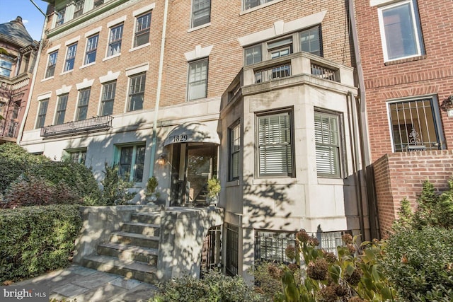 property entrance with brick siding