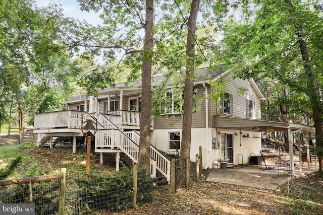 back of house with a patio, stairway, a wooden deck, and stucco siding