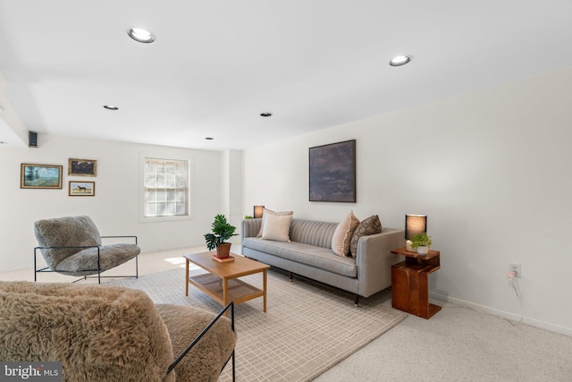 living room with recessed lighting, baseboards, and carpet floors