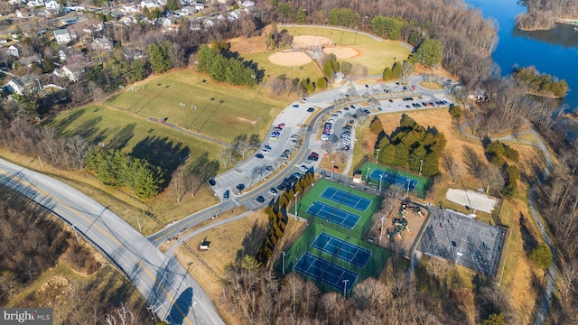 birds eye view of property with a water view