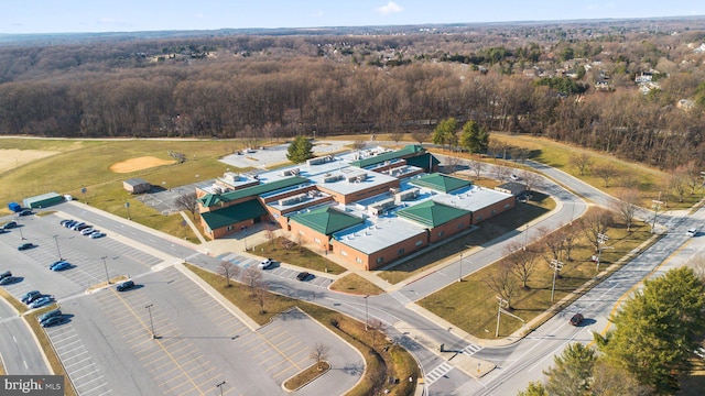 drone / aerial view featuring a forest view