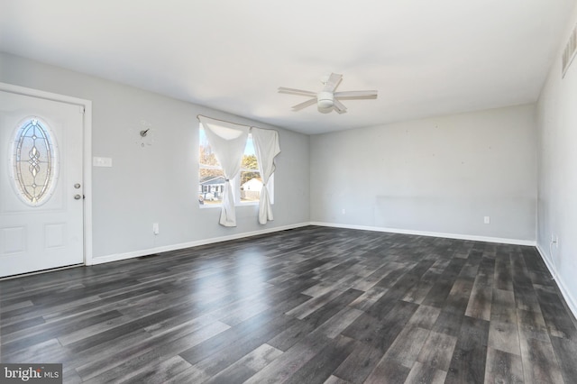 foyer with ceiling fan, dark wood-type flooring, visible vents, and baseboards