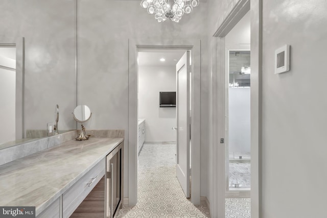 bathroom featuring beverage cooler and vanity