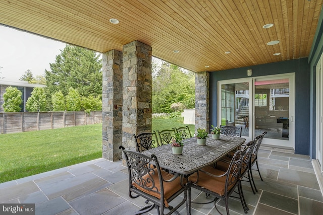 view of patio / terrace featuring outdoor dining area and fence