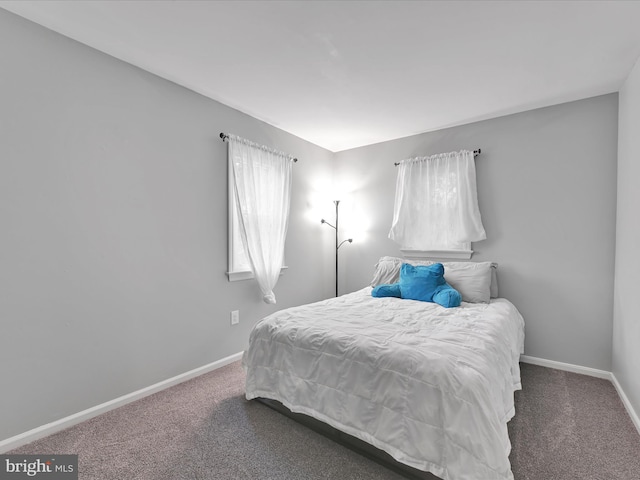 carpeted bedroom with baseboards