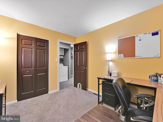 office with washer / dryer, carpet, and baseboards