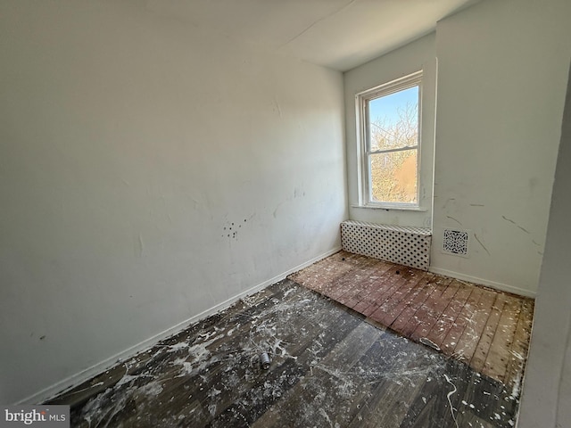 empty room featuring baseboards