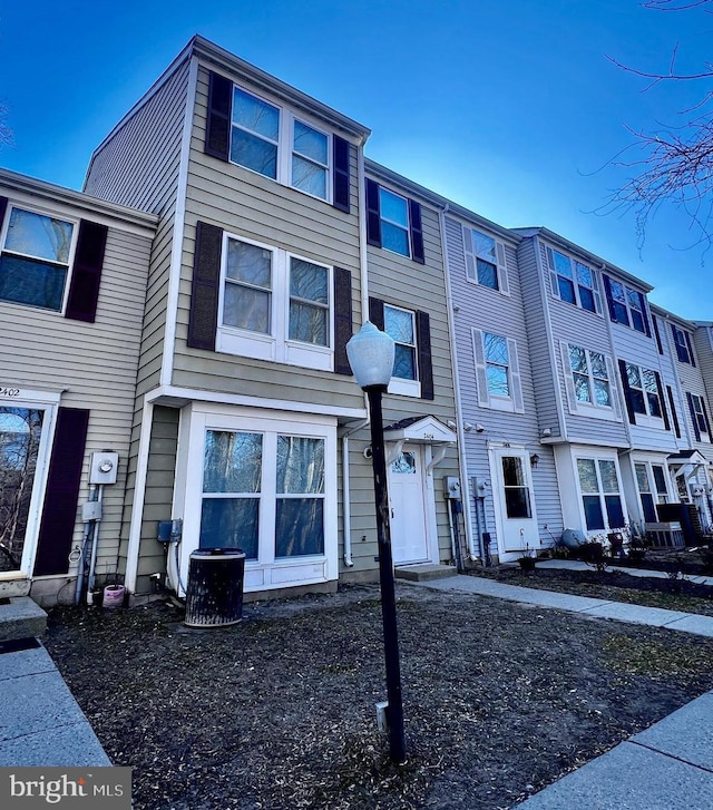 view of property featuring central AC unit