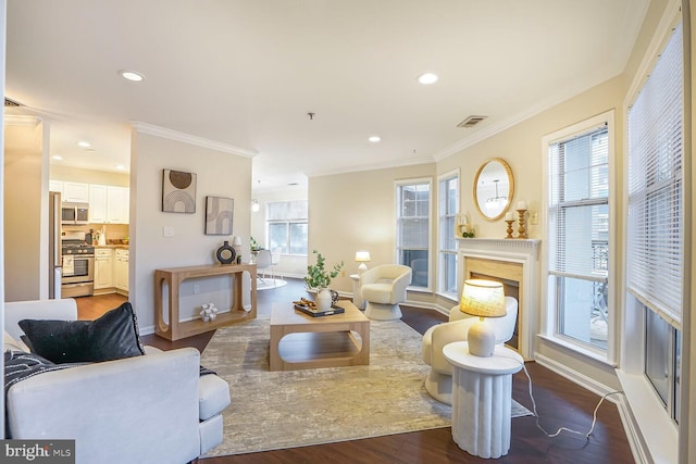 living room featuring a fireplace, crown molding, and dark wood-style flooring