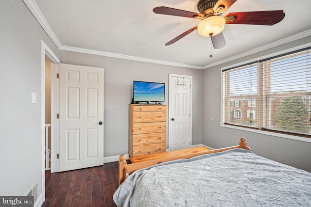 bedroom featuring baseboards, ceiling fan, wood finished floors, and crown molding