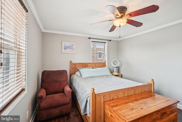 bedroom with ornamental molding and a ceiling fan