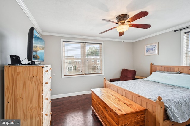 bedroom with dark wood-style floors, ornamental molding, a ceiling fan, and baseboards