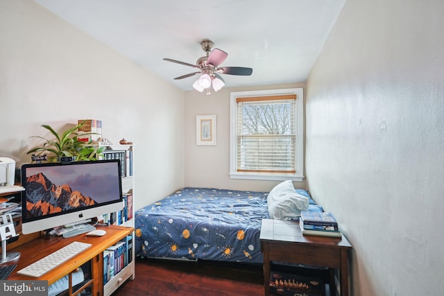 bedroom featuring a ceiling fan and wood finished floors