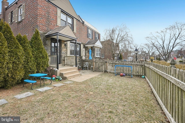 view of yard featuring fence and a residential view