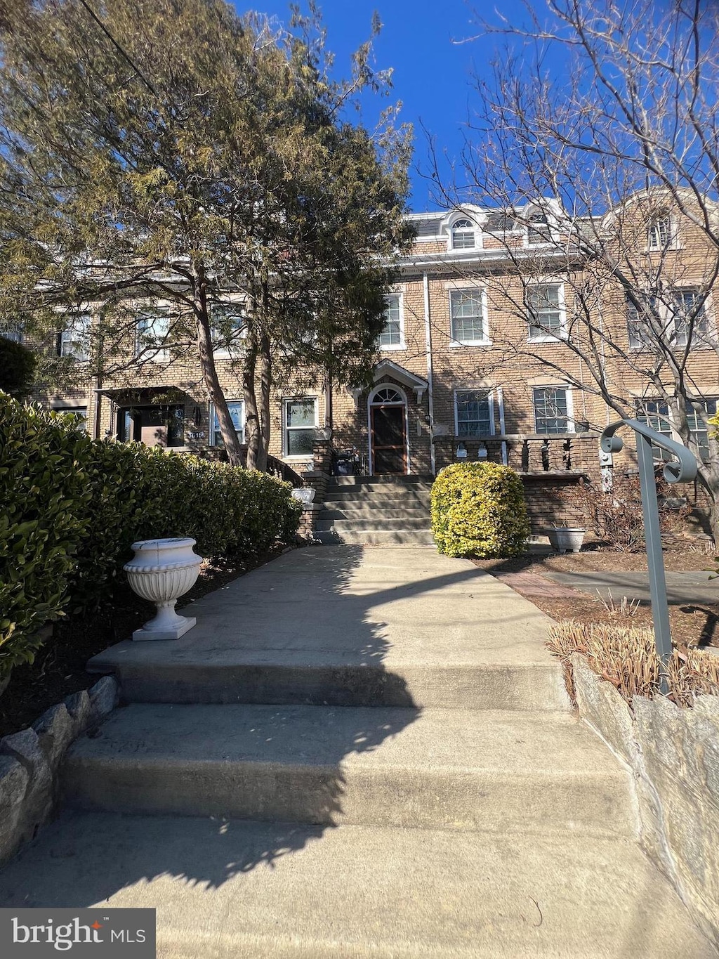 townhome / multi-family property with brick siding