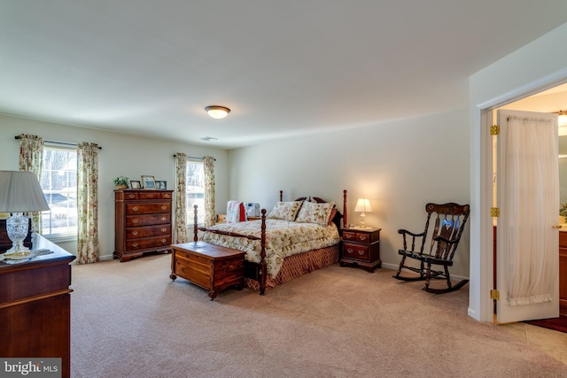 bedroom featuring carpet and baseboards