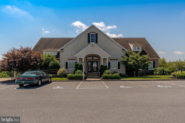 view of building exterior featuring uncovered parking