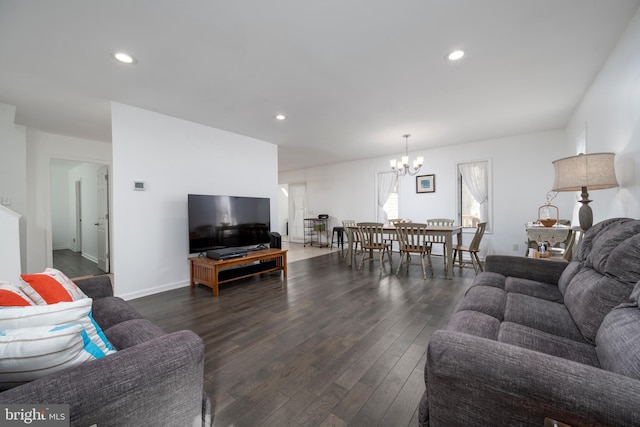 living area with recessed lighting, a notable chandelier, and dark wood finished floors