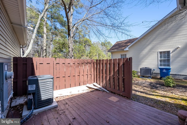 wooden deck with fence and central AC