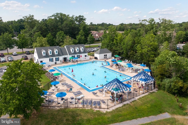 exterior space featuring a patio area, a water slide, and fence