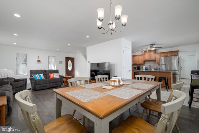 dining room with recessed lighting, wood finished floors, and ceiling fan with notable chandelier