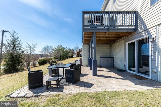 view of patio / terrace with a fire pit and a wooden deck