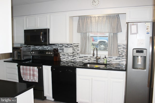 kitchen featuring decorative backsplash, black appliances, dark countertops, and a sink