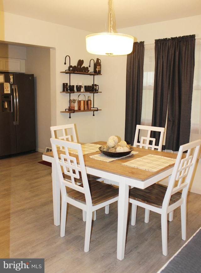 dining room with light wood-style floors