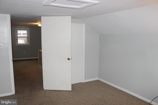 bonus room featuring lofted ceiling, carpet, and baseboards