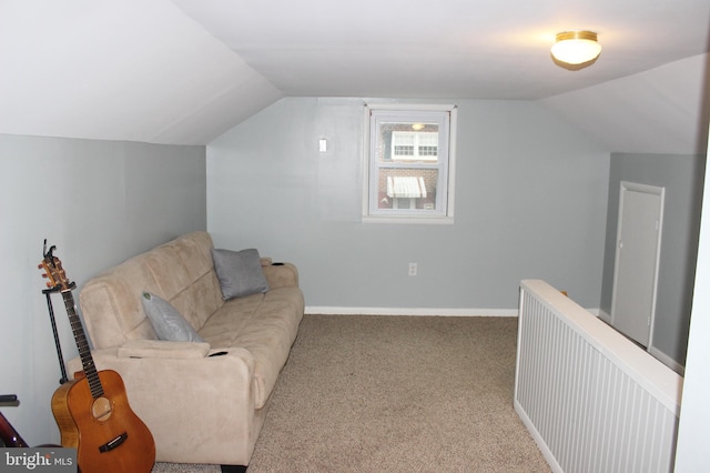 sitting room with baseboards, lofted ceiling, and carpet floors