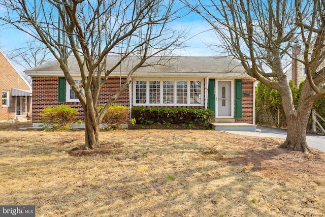 ranch-style house with brick siding