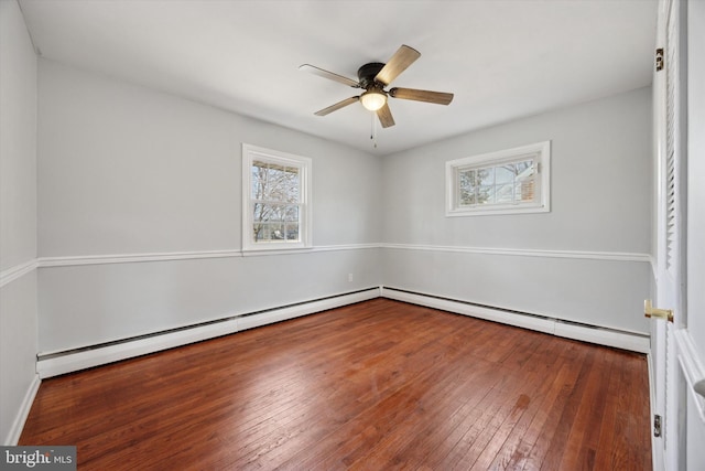 unfurnished room with ceiling fan, wood-type flooring, and baseboard heating