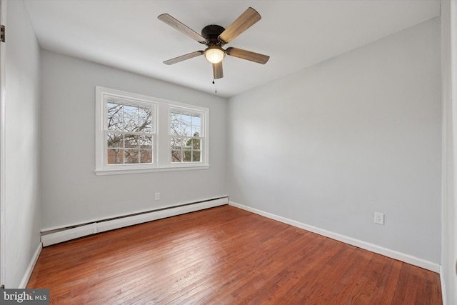 empty room featuring ceiling fan, a baseboard radiator, baseboards, and wood-type flooring