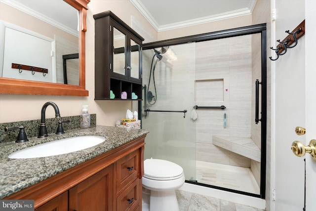full bathroom featuring vanity, toilet, a stall shower, and crown molding