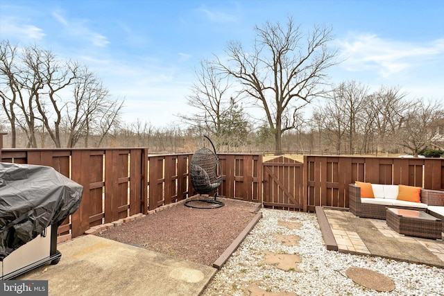 view of yard featuring a patio area, fence, and a gate