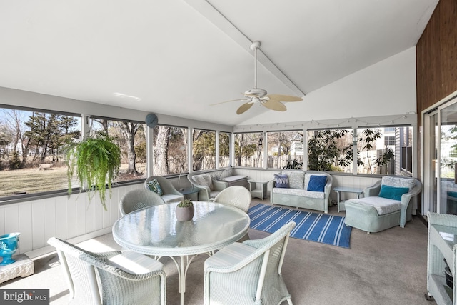 sunroom / solarium featuring lofted ceiling and ceiling fan