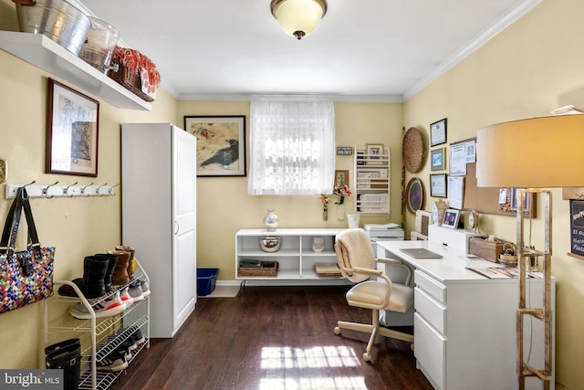 office featuring built in desk, baseboards, ornamental molding, and dark wood-type flooring