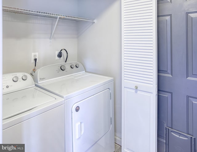 washroom featuring laundry area and washer and dryer