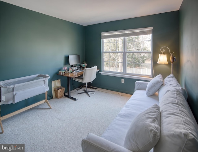 carpeted office featuring baseboards