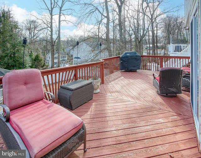 wooden terrace featuring grilling area