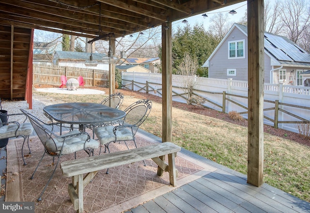 exterior space featuring a fenced backyard and outdoor dining area