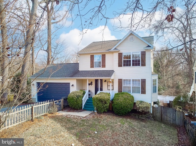 traditional home with a garage, fence, a porch, and roof with shingles