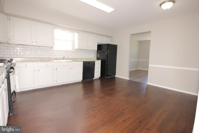 kitchen with black appliances, tasteful backsplash, white cabinets, and dark wood-type flooring