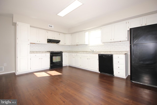 kitchen with black appliances, under cabinet range hood, visible vents, and white cabinets