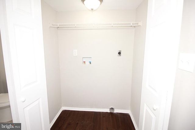 clothes washing area featuring dark wood-style flooring, hookup for a washing machine, hookup for an electric dryer, laundry area, and baseboards