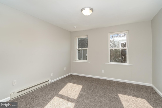 unfurnished room with carpet floors, baseboard heating, and baseboards