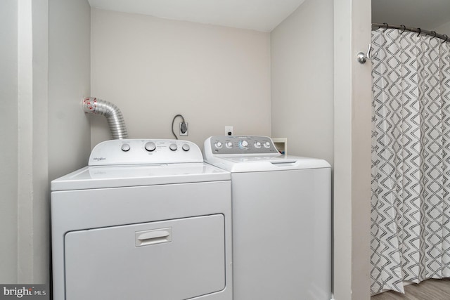 washroom featuring washer and dryer