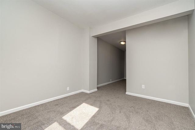 spare room with carpet floors and baseboards