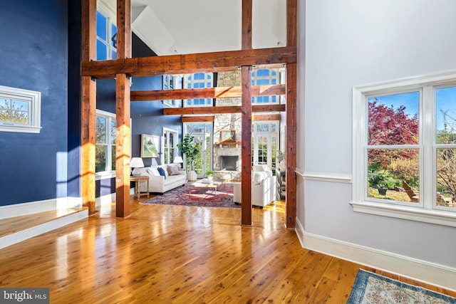 living room with a healthy amount of sunlight and a towering ceiling