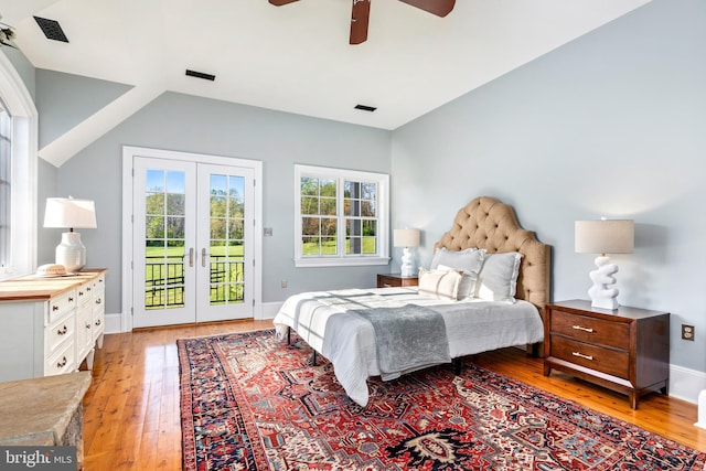 bedroom with visible vents, french doors, light wood-type flooring, baseboards, and access to outside